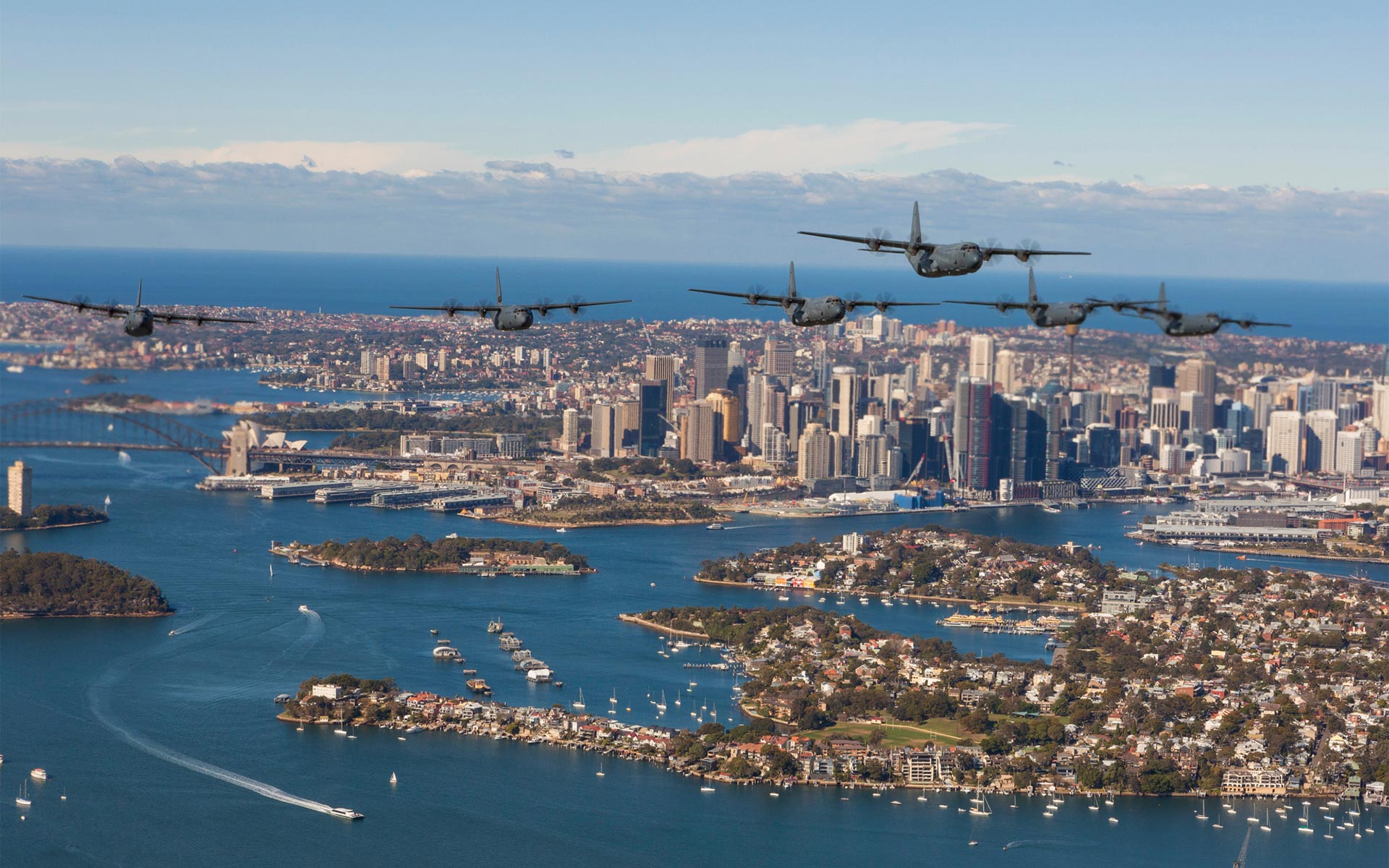 Military transport aircraft flying over Sydney