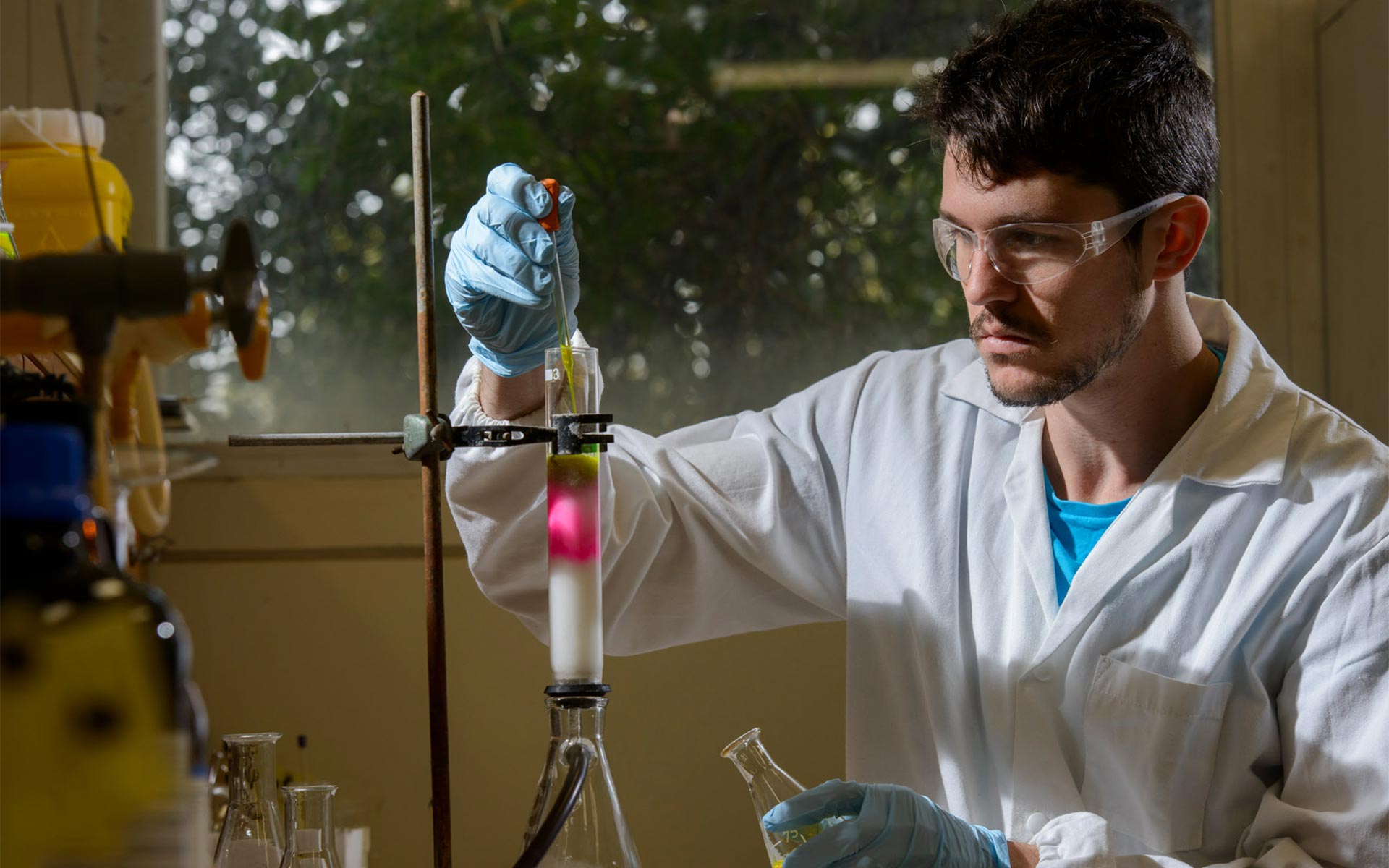 Male chemist with a test tube