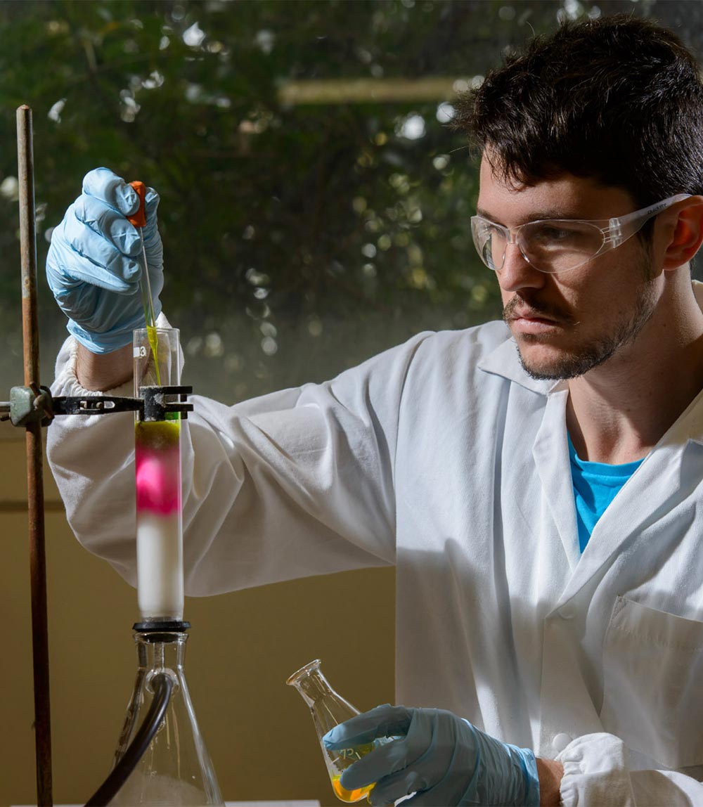 Male chemist with a test tube