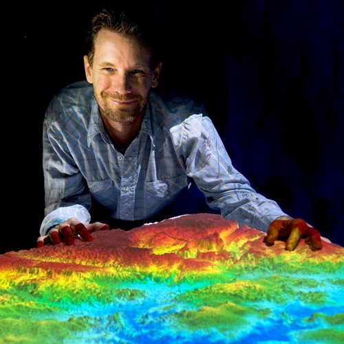 Man presenting projected digital elevation model