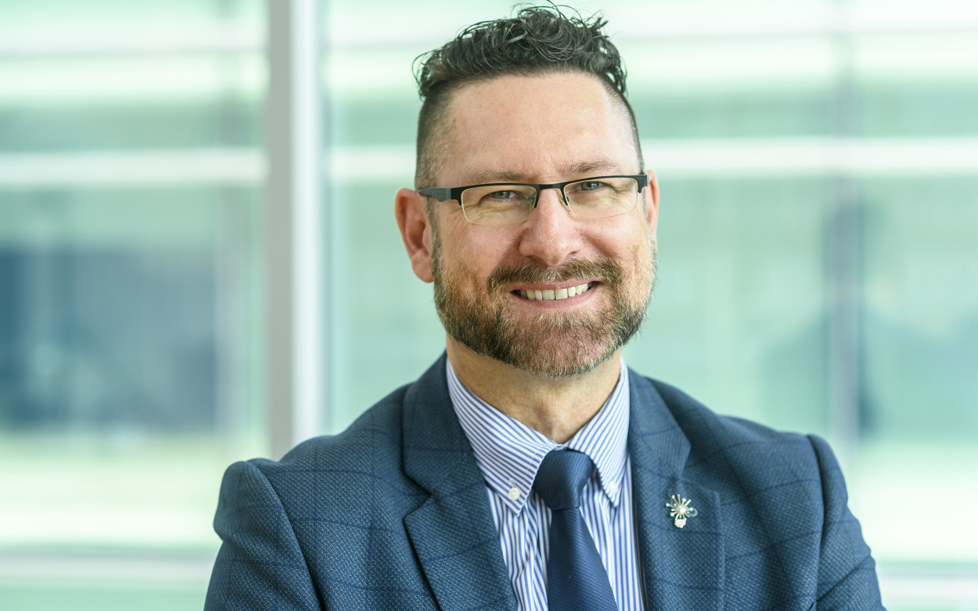 Professional man posing for a corporate style headshot